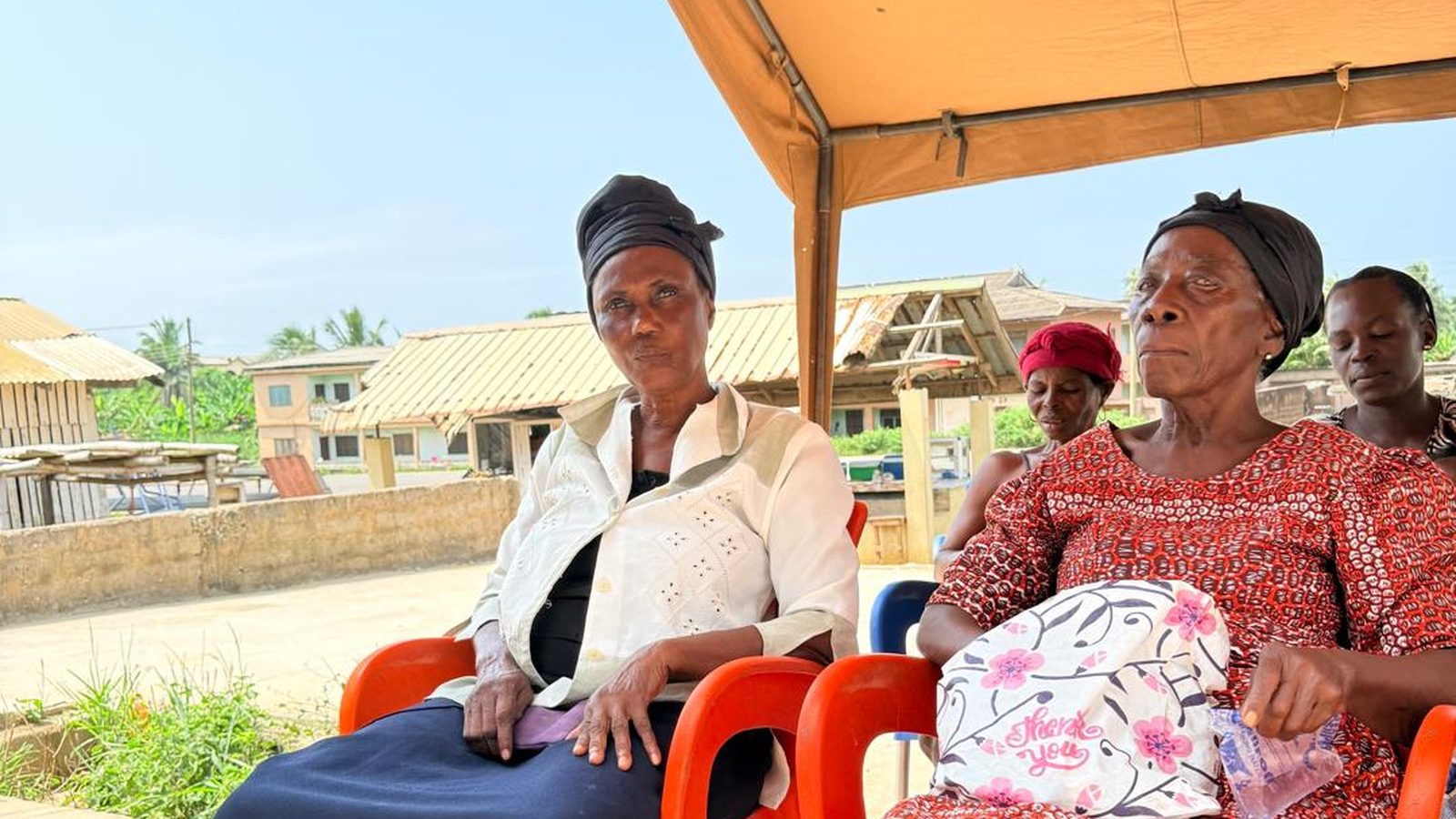 Elderly women receiving support from Divine Love Ministry